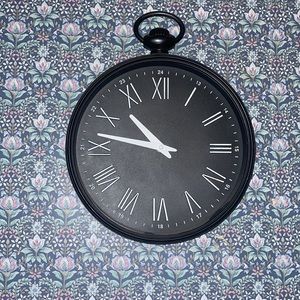 Black Roman numeral clock is functional